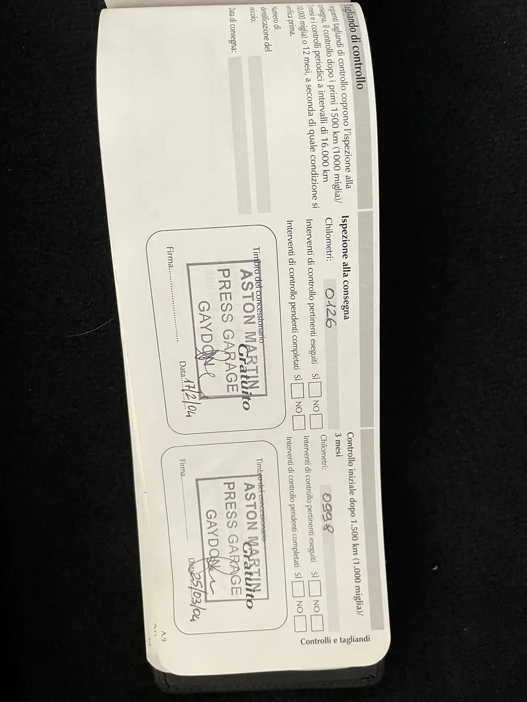 Original Aston Martin Press Garage Gaydon stamp in the service booklet